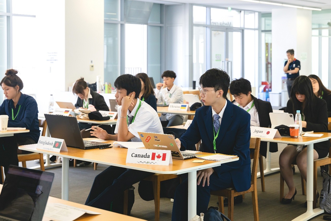 Above: Delegates representing nations from Germany to Canada try to tackle the biggest issue facing humanity in the 21st century